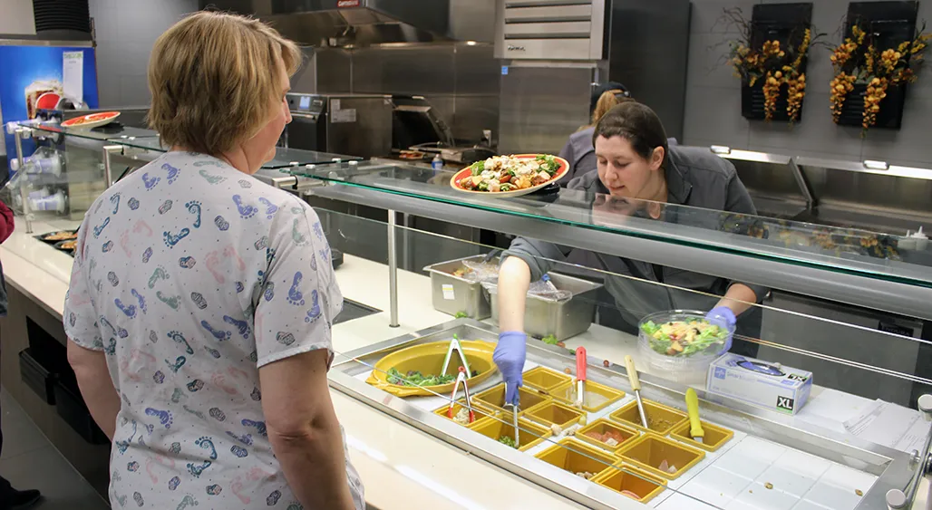 Culinary team preparing plant-forward dishes in a hospital kitchen